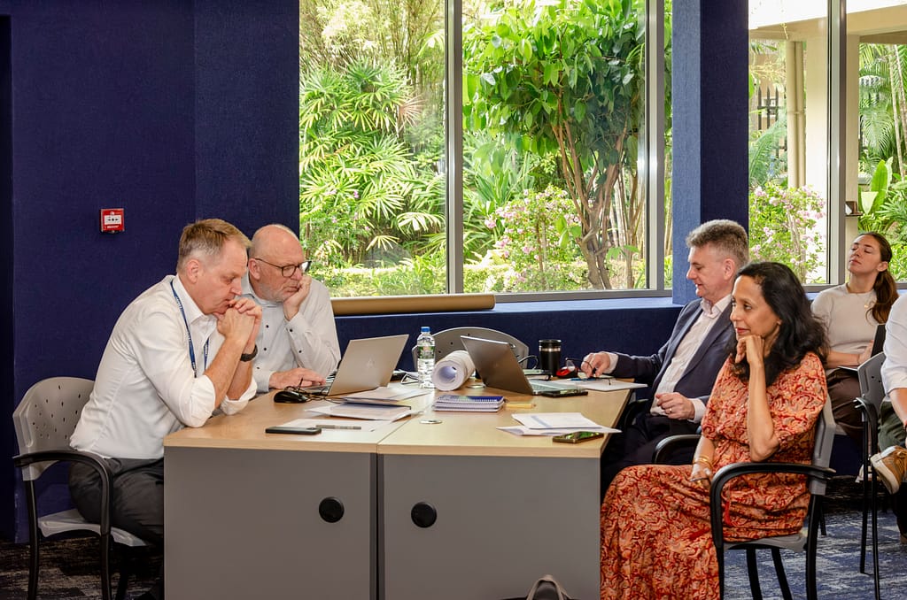 From left, Mark Smith and, at right, Vidhisha Samarasekara of IWMI, seated with colleagues, discuss next steps for the Water Resilience Tracker. Photo: Sampath Ranawaka/IWMI