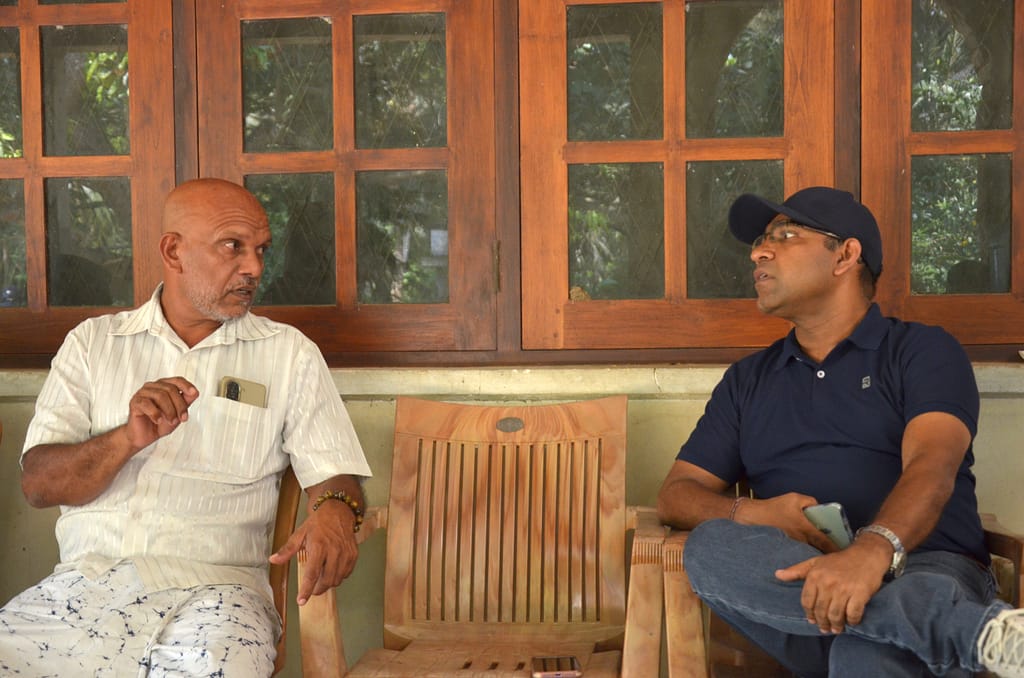H. U. D. Herath, a farmer from Kurunegala, Sri Lanka, speaking with Niranga Alahacoon, a regional researcher at the International Water Management Institute (IWMI), on March 6, 2026. Photo: Hasti Sadri/IWMI