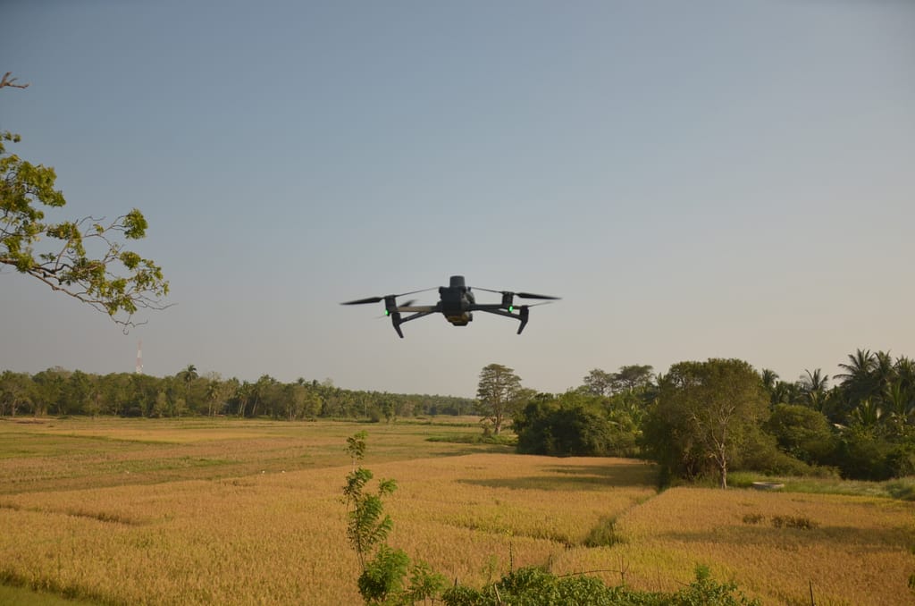 A drone from the International Water Management Institute (IWMI) collecting data in a paddy field in Kurunegala, Sri Lanka on March 6, 2026. Photo: Hasti Sadri/IWMI