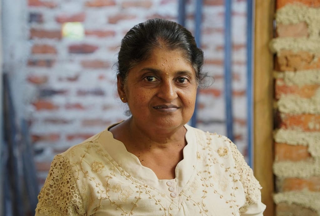 A portrait of Aruna Farmer Organization Secretary Sardha Dayanshani in Kurunegala, Sri Lanka, on March 6, 2026. Photo: Lahiru Madushanka/IWMI