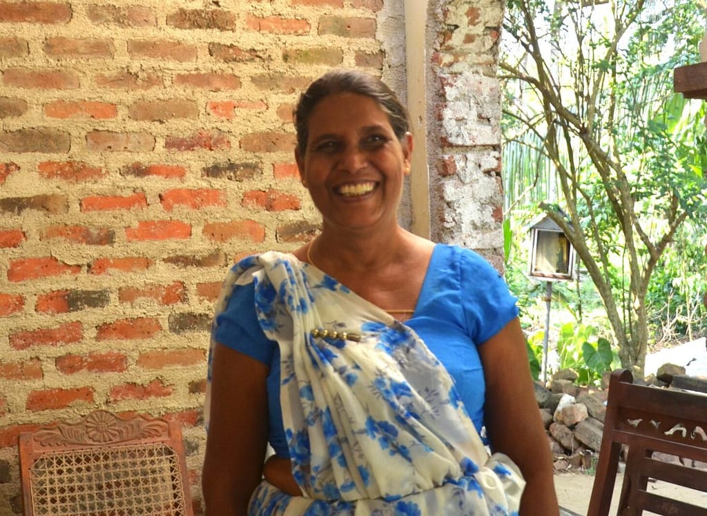 A portrait of C. Dayawathi, Agriculture research and production assistant, in Kurunegala, Sri Lanka on March 6, 2026. Photo: Hasti Sadri/IWMI