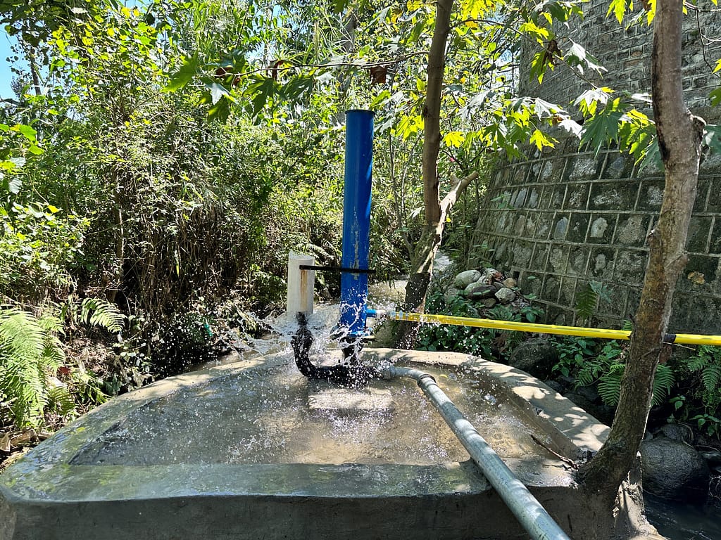 A hydraulic ram pump installed in Ichrian village lifts water from the stream to hilltop settlements using only the natural force of flowing water, without electricity or fuel. Photo: Amjad Jamal/IWMI