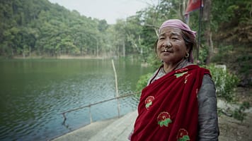 Kheema Devi Rana, a farmer from Alital, Nepal, explaining how development benefits some communities while displacing others. Photo: Aayush Niroula/IWMI